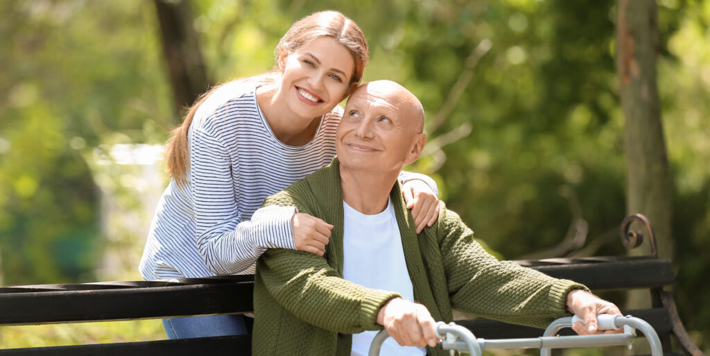 elderly man with his daughter in park