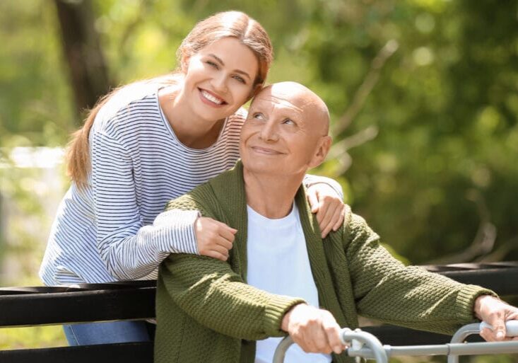 elderly man with his daughter in park