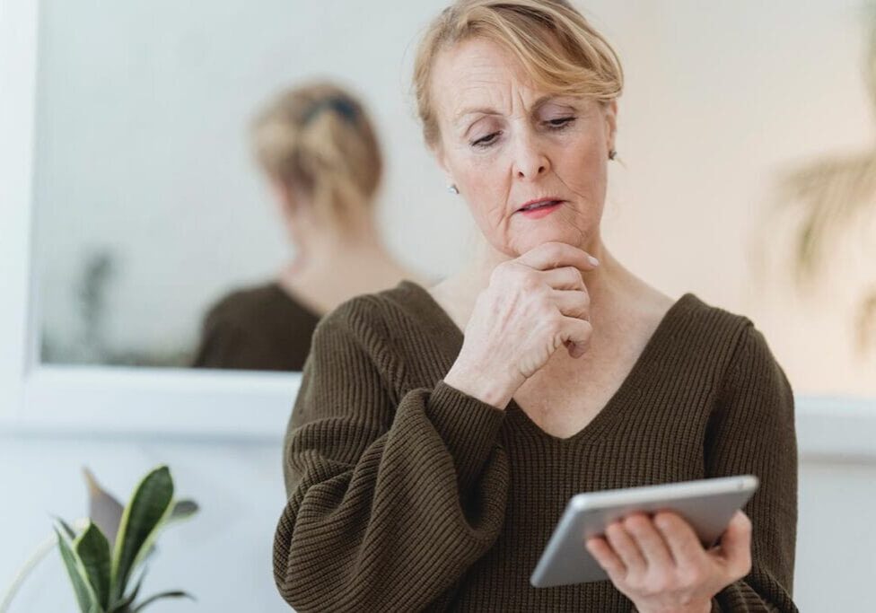 woman looking at a tablet